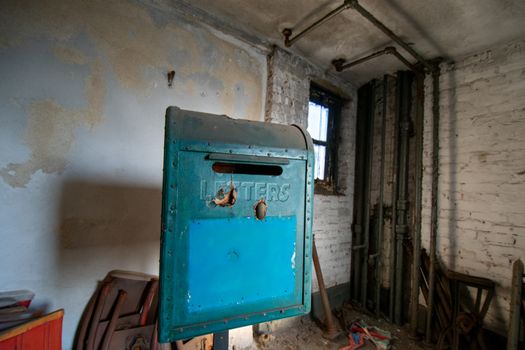 An Old Blue Mailbox Used as a Prop in an Abandoned Theatre