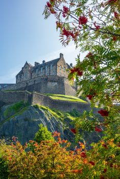 Edinburgh Castle, With Focus On Trees In Princes Street Gardens In The Foreground