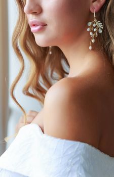 .Close-up portrait of a beautiful bride on her wedding day with professional makeup and styling