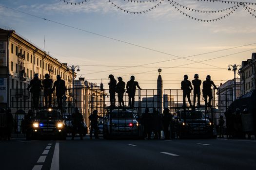 Minsk, Belarus - September 20, 2020: Riot police blocking the road for protesters with water cannons, cages and shields