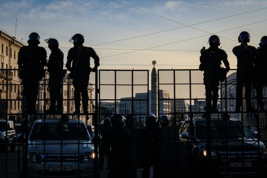 Minsk, Belarus - September 20, 2020: Riot police blocking the road for protesters with water cannons, cages and shields