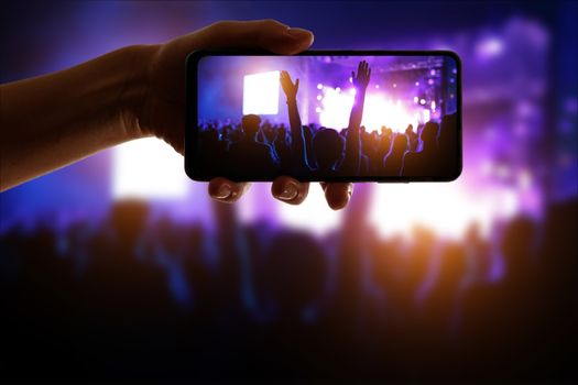 Crowds Enjoying Themselves At Outdoor Music Festival, Night time