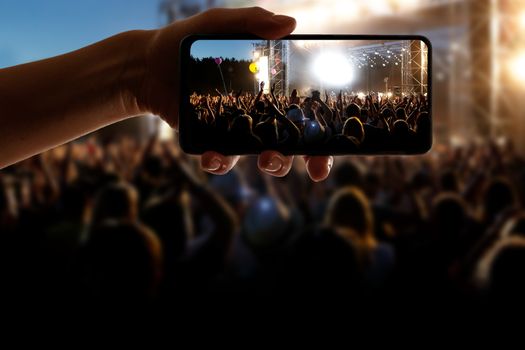 Crowds Enjoying Themselves At Outdoor Music Festival, Night time