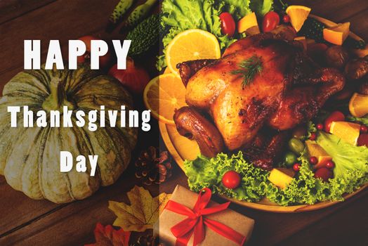 Thanksgiving roasted turkey or chicken and vegetables, Top view Christmas dinner feast food decoration traditional homemade on wooden table background, Happy thanksgiving day of holiday concept