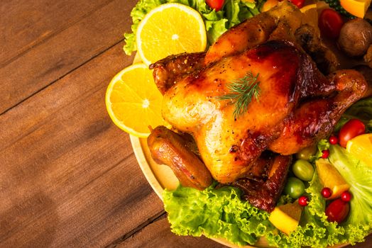 Thanksgiving roasted turkey or chicken and vegetables, Top view Christmas dinner feast food decoration traditional homemade on wooden table background, Happy thanksgiving day of holiday concept