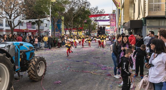 Loule, Portugal - February 25, 2020: dancers parading in the street in front of the public in the parade of the traditional carnival of Loule city on a February day