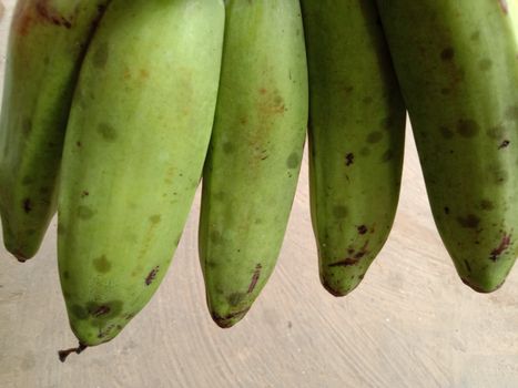 tasty and healthy raw banana bunch with blur background