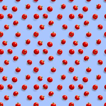 Seamless pattern with red ripe tomatoes. Tomato isolated on blue background. Vegetable abstract seamless pattern. Organic Tomatoes flat lay.