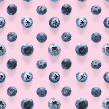 Trendy seamless pattern of blueberries. Blueberry pattern isolated on pink background. Blueberry flat lay, can be used for textile, prints, packing designs orother moden andcreative works