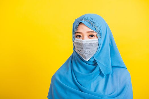 Asian Muslim Arab, Portrait of happy beautiful young woman religious wear veil hijab smiling studio shot isolated, yellow background with copy space, Close up skin face