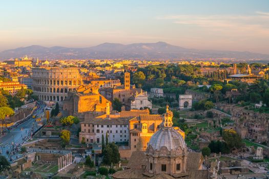 Top view of  Rome city skyline with Colosseum and Roman Forum in Italy.