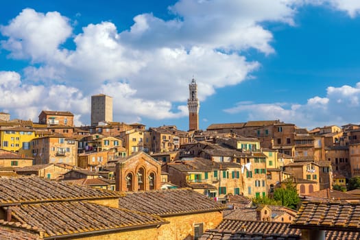 Downtown Siena skyline in Italy with morning blue sky