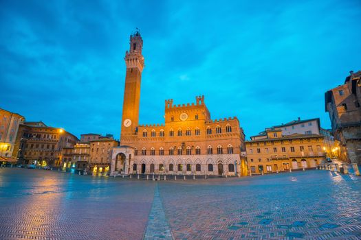 Piazza del Campo in downtown Siena, Italy at twilight