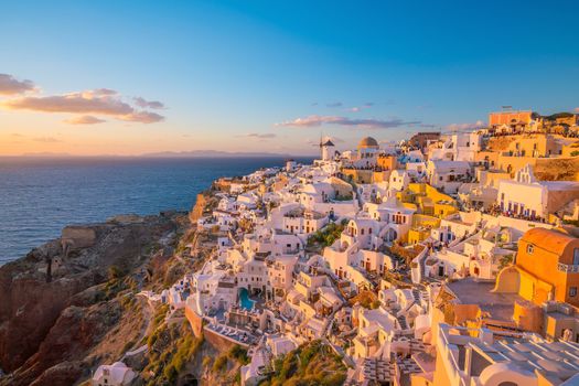 Oia town cityscape at Santorini island in Greece at sunset. Aegean sea