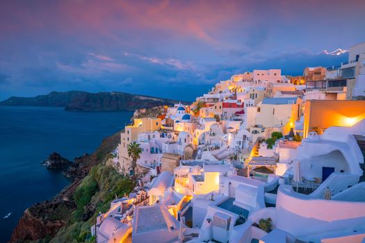 Oia town cityscape at Santorini island in Greece at sunset. Aegean sea