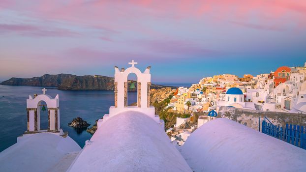 Oia town cityscape at Santorini island in Greece at sunset. Aegean sea