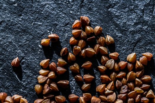 Buckwheat grain closeup, food texture and cook book backgrounds