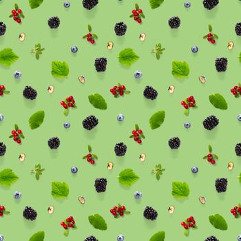 Creative seamless pattern of wild berries, blackberry, blueberry, lingonberry and bramble. modern seamless pattern on green backgriund made from autumn forest wild berries. Forest berries mix