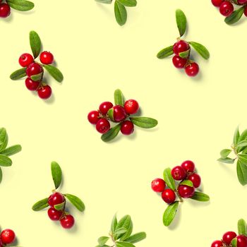 Lingonberry seamless pattern on yellow background. Fresh cowberries or cranberries with leaves as seamless pattern for textile, fabric, print or posters