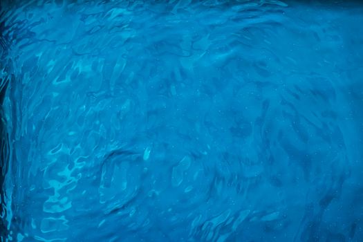 Blue water texture as abstract background, swimming pool and waves designs