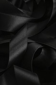 Black silk ribbon as background, abstract and luxury brand designs