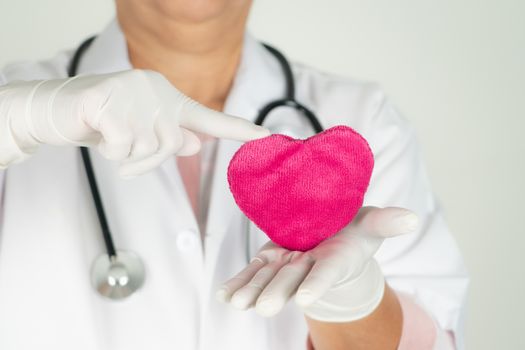 World heart health day concept and Healthcare medical insurance with doctor with stethoscope holding red heart