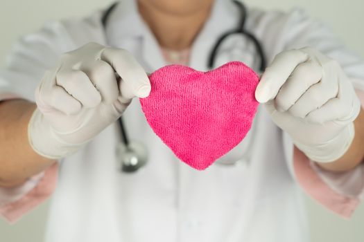 World heart health day concept and Healthcare medical insurance with doctor with stethoscope holding red heart