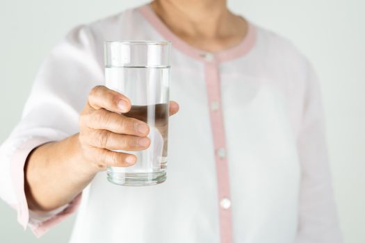 drinking water in the senior woman's hand, Concept of environment protection, healthy drink.