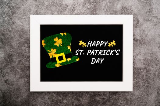 St Patricks day, festive leprechaun hat and green Shamrocks on photo frame