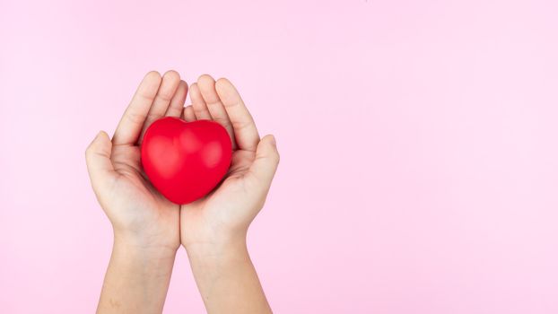 world health day, child hands holding red heart, healthcare, love and family insurance concept