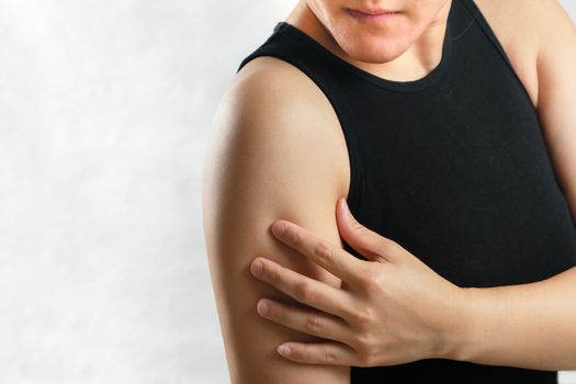 arm and shoulder pain/injury women with white backgrounds, healthcare and medical concept