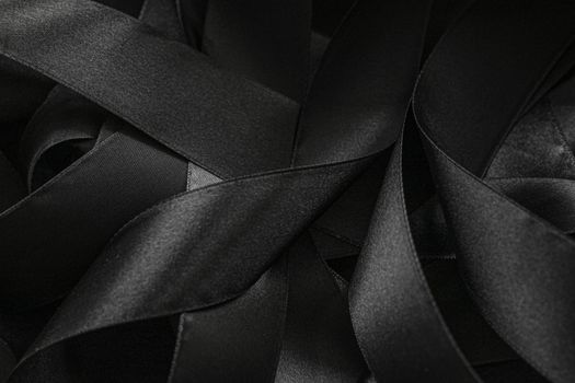 Black silk ribbon as background, abstract and luxury brand designs