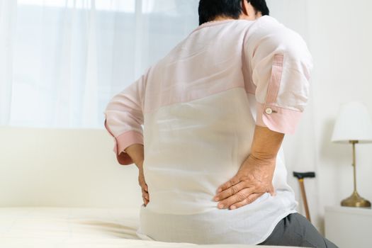 Back pain of old woman at home, healthcare problem of senior concept