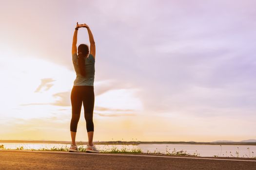 sport woman is stretching muscle before workout