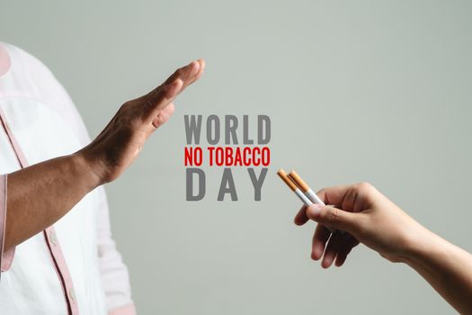 Quit smoking, no tobacco day, mother hands gesture reject proposal the cigarette