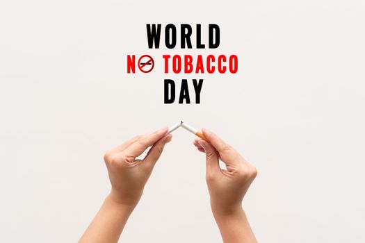 Quit smoking, no tobacco day, woman hands breaking the cigarette