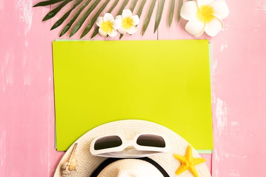 Beautiful summer holiday, Beach accessories, sea shells, hat, sunglasses and palm leave on paper for copy space