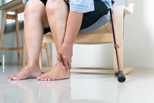 Ankle leg pain of senior woman at home, healthcare problem of senior concept