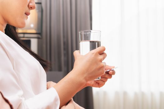 sick women hand hold a glass of water, healthcare and medicine recovery concept