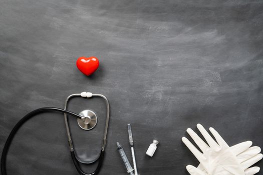 Healthcare medical insurance with red heart, stethoscope and medical supplies