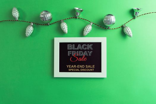 Black Friday Sale concept, photo frame on green background