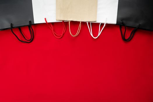 black friday sale, shopping bag on red background