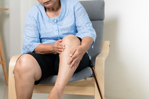 Leg pain of senior woman at home, healthcare problem of senior concept