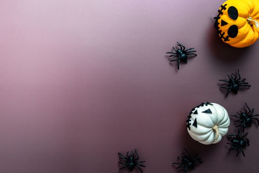 Happy Halloween, horror pumpkin and scary spider on purple background