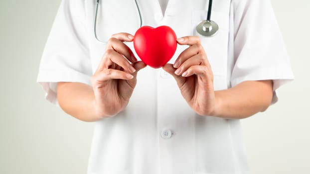 World heart day concept of woman doctor hand holding red heart