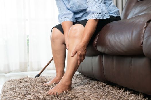 Leg pain of senior woman at home, healthcare problem of senior concept