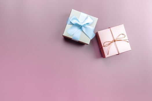 Two gift box on pink background for special day