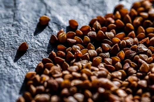 Buckwheat grain closeup, food texture and cook book backgrounds