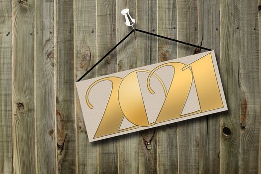 Gold number 2021 on wood background. New Year concept