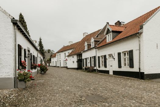Street in the historic city of Thorn in Limburg, the Netherlands. Known for its white houses. also called the white city, it was painted white because of tax rules in the ancient times